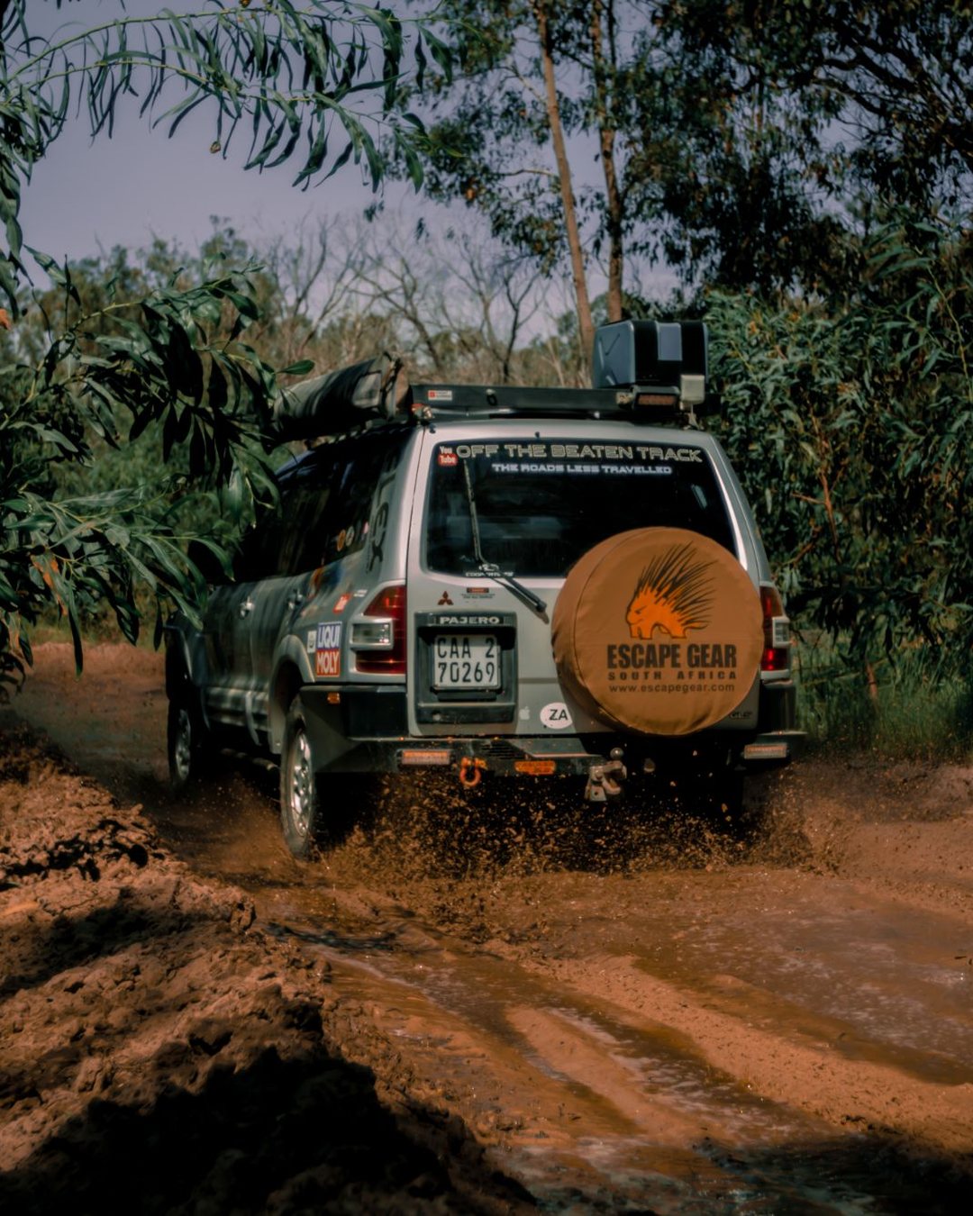 Escape Gear: the Pajero driving through a muddy forest track